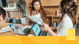 Banner for article about running a journal., showing three people sitting around a table with laptops planning a project.