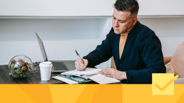 Banner for article about why peer review matters, showing a man working on a peer review report at a desk.