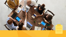 A person managing a team during a meeting.