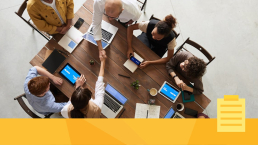 A person managing a team during a meeting.