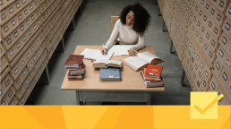 A woman at a desk finding good peer reviewers.