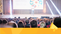 People attending a conference and discussing journal readership.