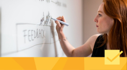 A woman working on peer review management tools planning.