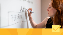 A woman working on peer review management tools planning.