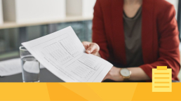 A woman looking at data during the peer review process.