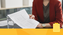 A woman looking at data during the peer review process.