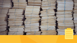 Stacks of paper representing article submissions.