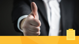 A person displaying confidence by giving a thumbs up.