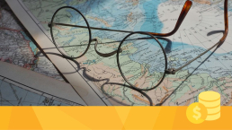 A pair of glasses on a map showcasing geographic diversity.