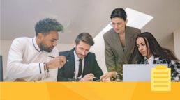 A group of employees discussing how best to organize journal submissions.